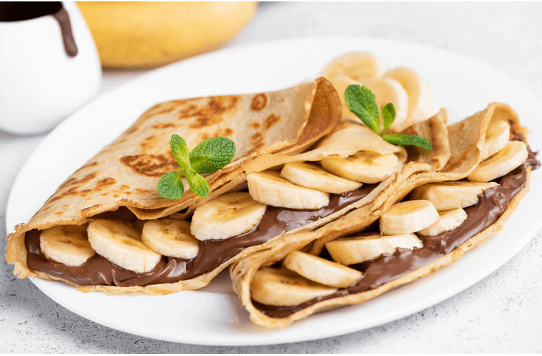 Chocolate Spread Banana Crepes on a white plate