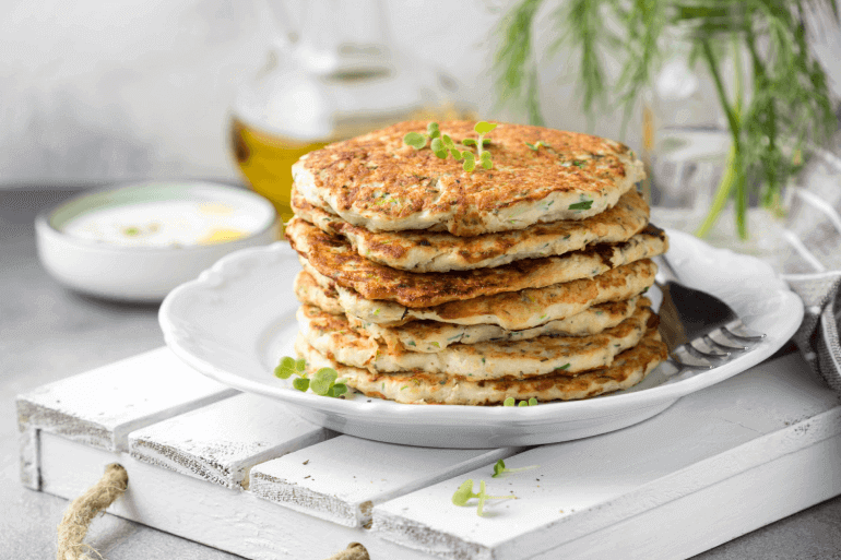 A plate of Savoury Indian Pancakes on a white plate